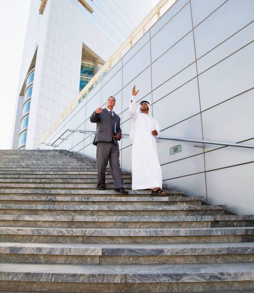 Businessmen walking down steps Businessmen walking down steps